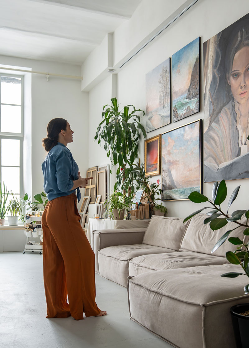 women-viewing-gallery-wall Home owner viewing gallery wall