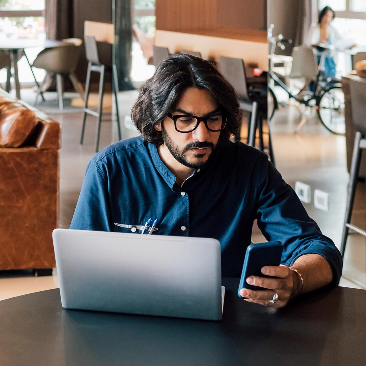 man-on-phone man on phone working in a office environment